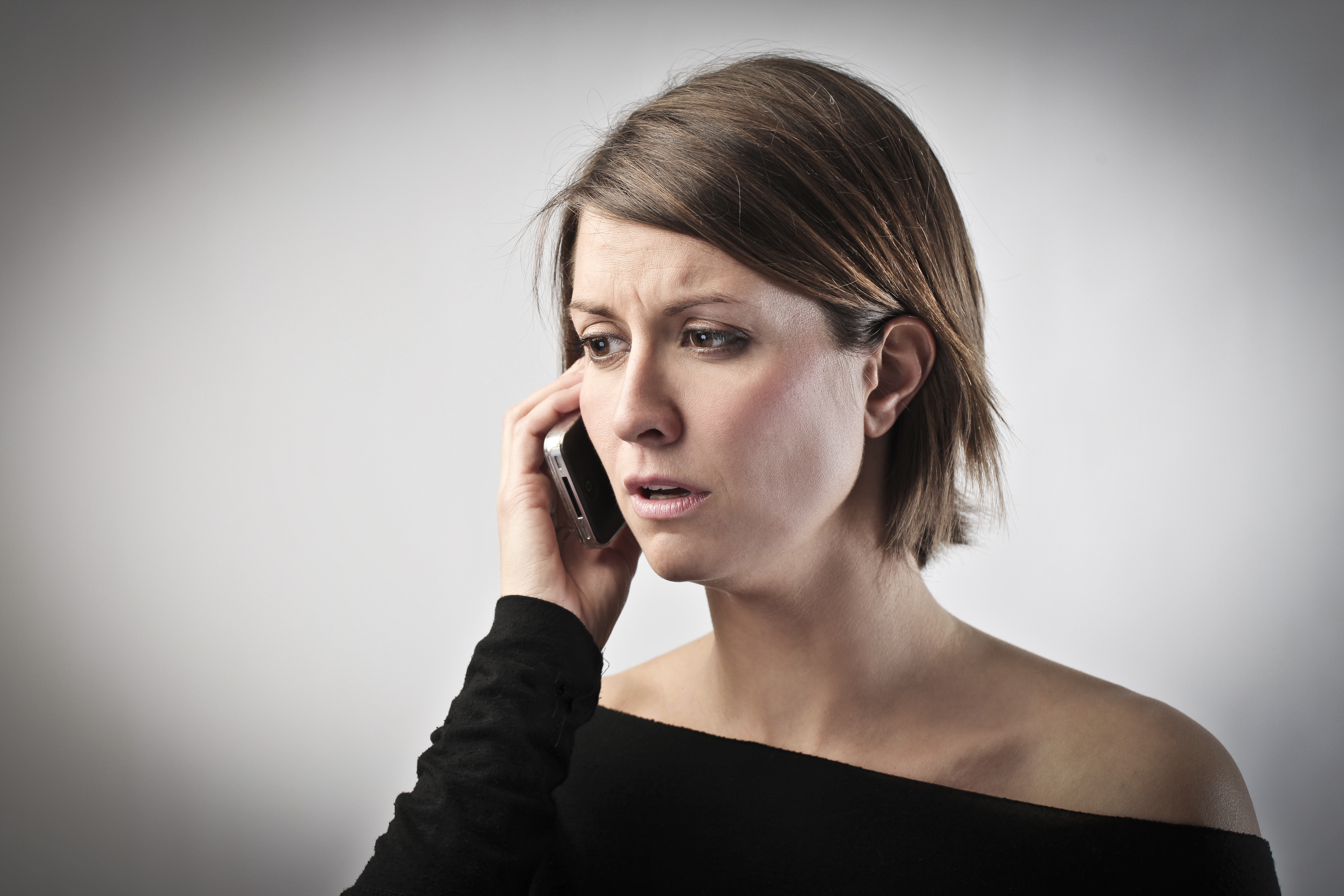 Worried woman on the phone