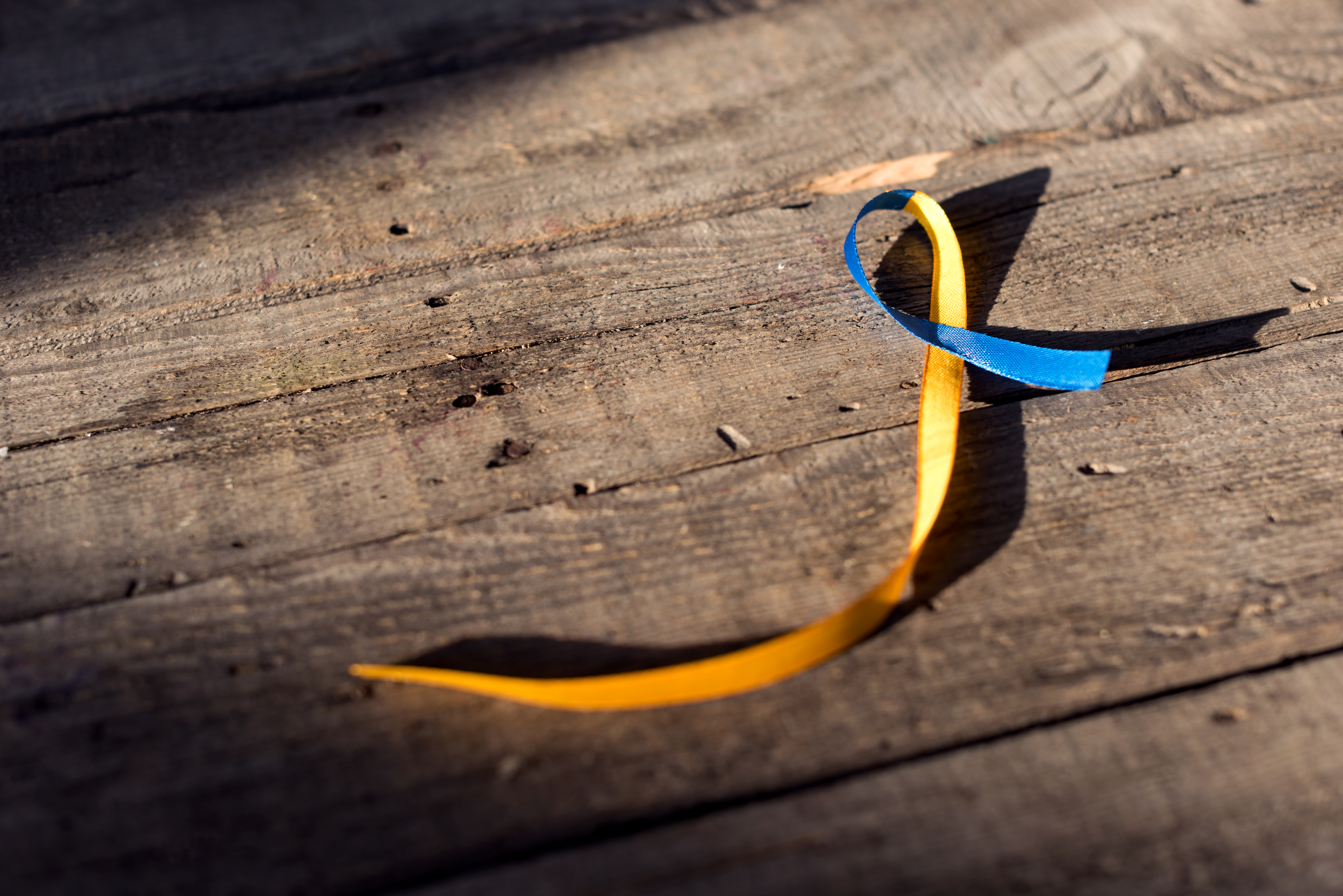 elder abuse awareness ribbon on wood table